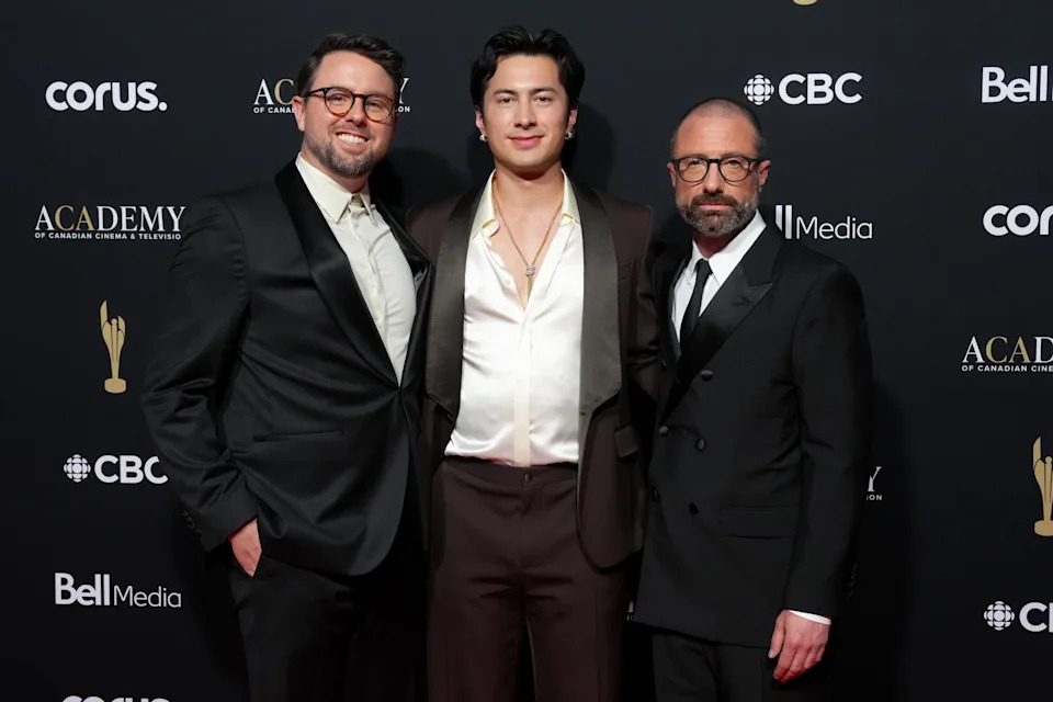 Heated Rivalry co-star Hudson Williams, centre, poses with show creator Jacob Tierney, left, and producer Brendan Brady on the red carpet at The Canadian Screen Awards in Toronto on Sunday, May 31, 2026. THE CANADIAN PRESS/Chris Young