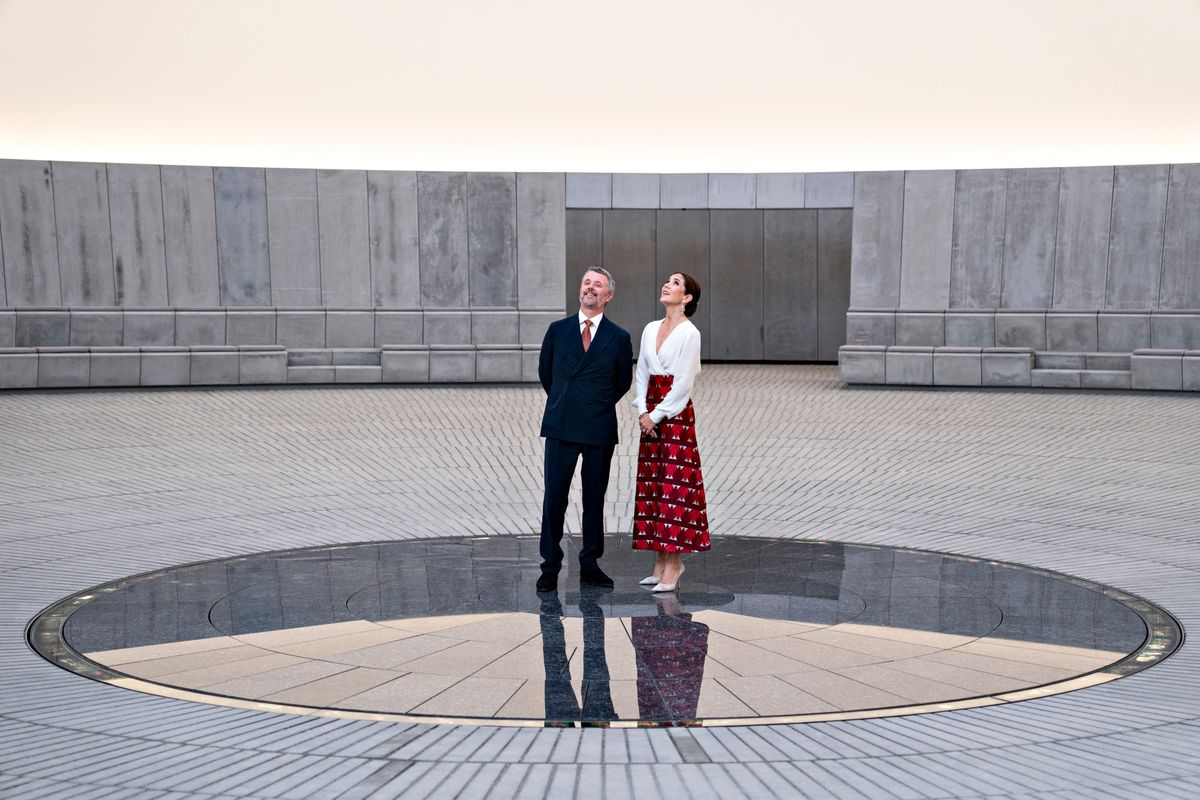 Queen Mary showcased her signature elegance in a vibrant red printed skirt paired with a classic ivory blouse during a visit to ARoS Art Museum in Aarhus.