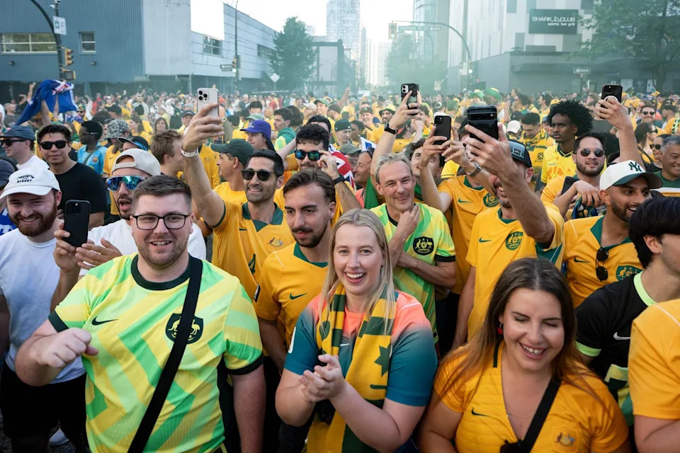Australia fans march to the entrance of B.C. Place before the first half of a World Cup Group D soccer match, in Vancouver, on Saturday, June 13, 2026. THE CANADIAN PRESS/Ethan Cairns