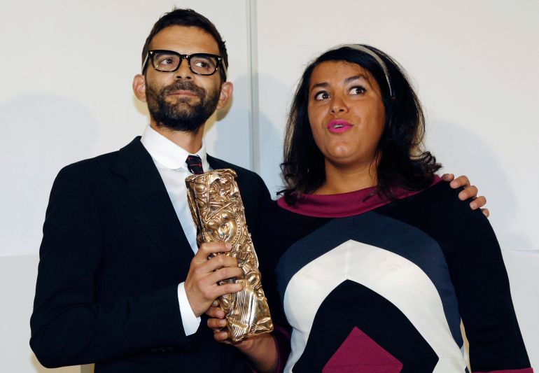 French directors Marjane Satrapi (R) and Vincent Paronnaud pose with their award for best debut film for 