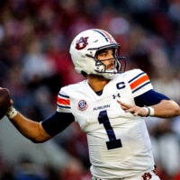 Nov 30, 2024; Tuscaloosa, Alabama, USA; Auburn Tigers quarterback Payton Thorne (1) throws against the Alabama Crimson Tide during the second quarter at Bryant-Denny Stadium.