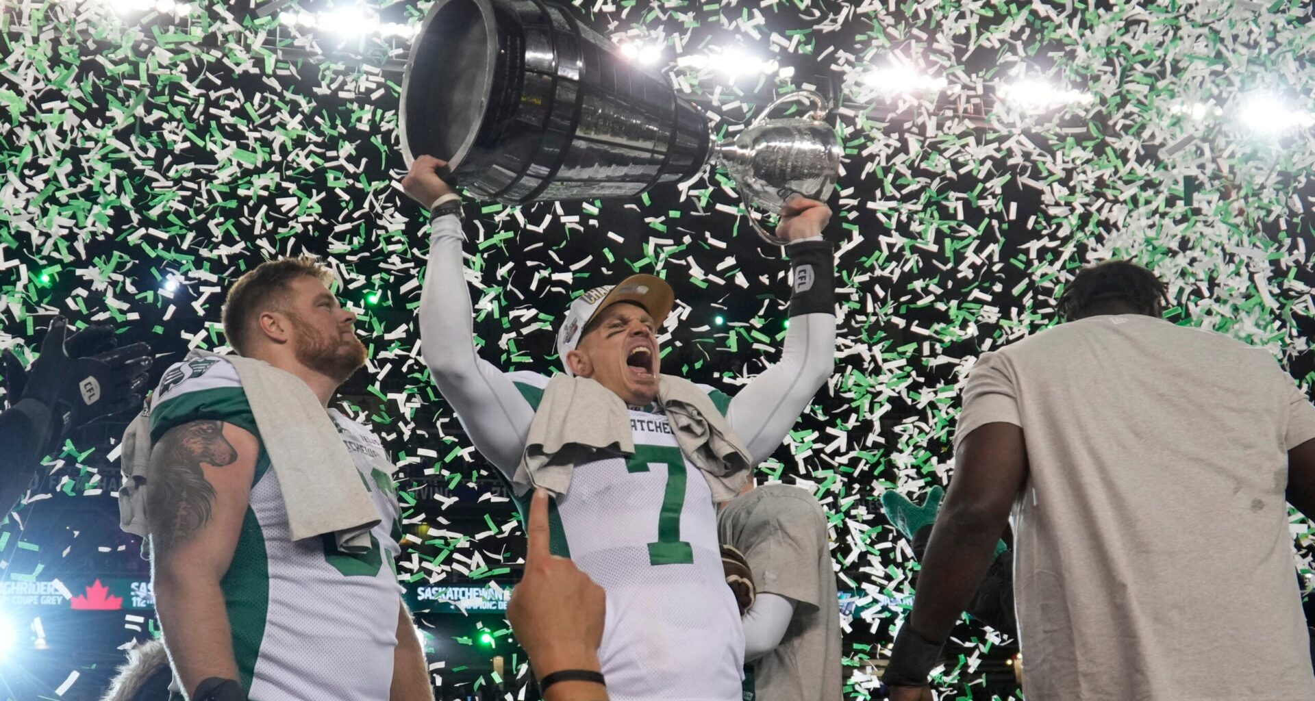 Nov 16, 2025; Winnipeg, Manitoba, Canada; Saskatchewan Roughriders quarterback Trevor Harris (7) lifts the Grey Cup in celebration of the win against the Montreal Alouettes during the 112th Grey Cup Championship at Princess Auto Stadium.