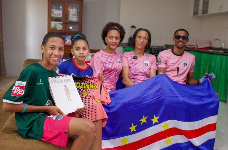 Ana Candida Evora, the mother of of Cape Verde's goalkeeper Vozinha, poses for a photograph with other family members at her home in Mindelo, Sao Vicente, Cape Verde