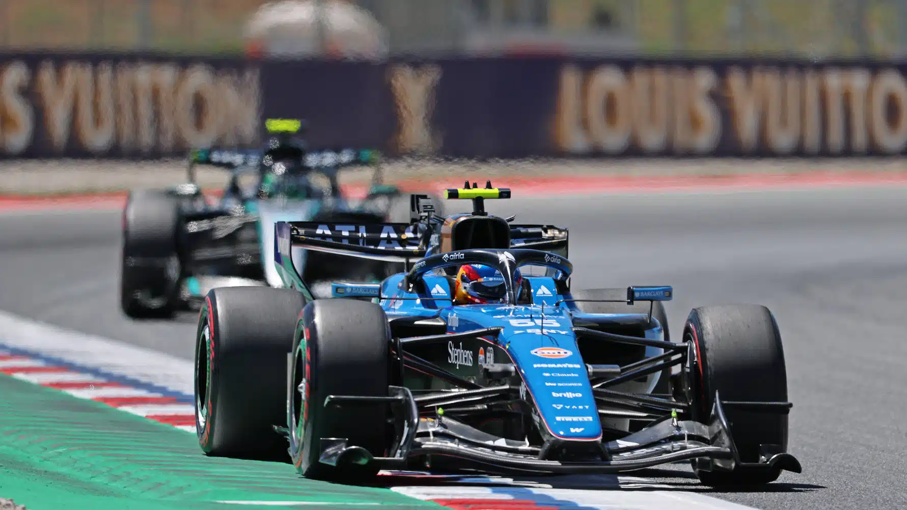 Carlos Sainz Jr (Williams-Mercdedes) leads Frederik Vesti (Mercedes) during practice the 2026 Catalunya Grand Prix