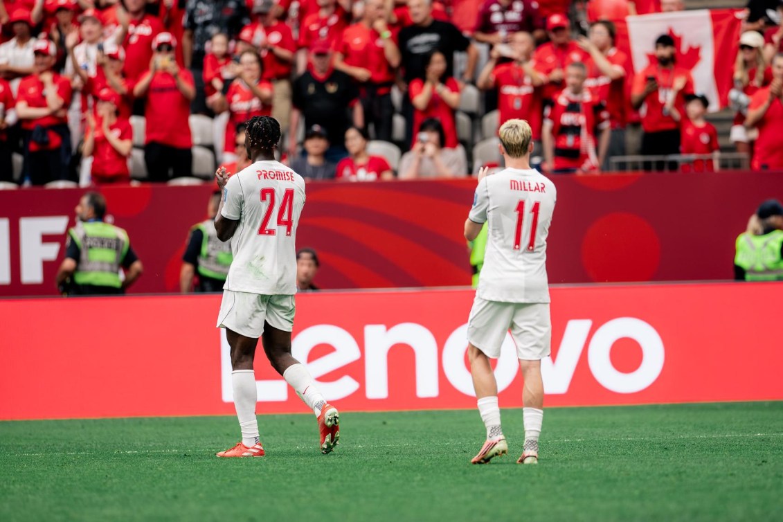 Canada's Promise David and Liam Millar acknowledge the crowd at Vancouver's BC Place.