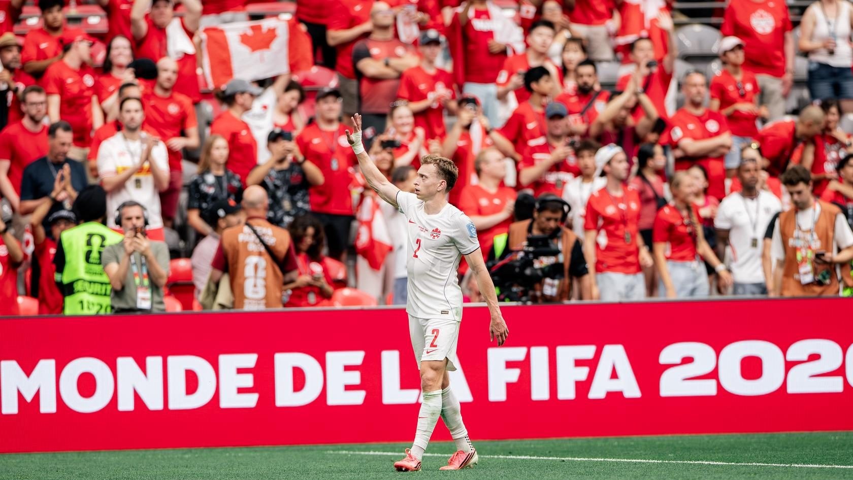 Canada defender Alistair Johnston waves to the crowd at BC Place in Vancouver