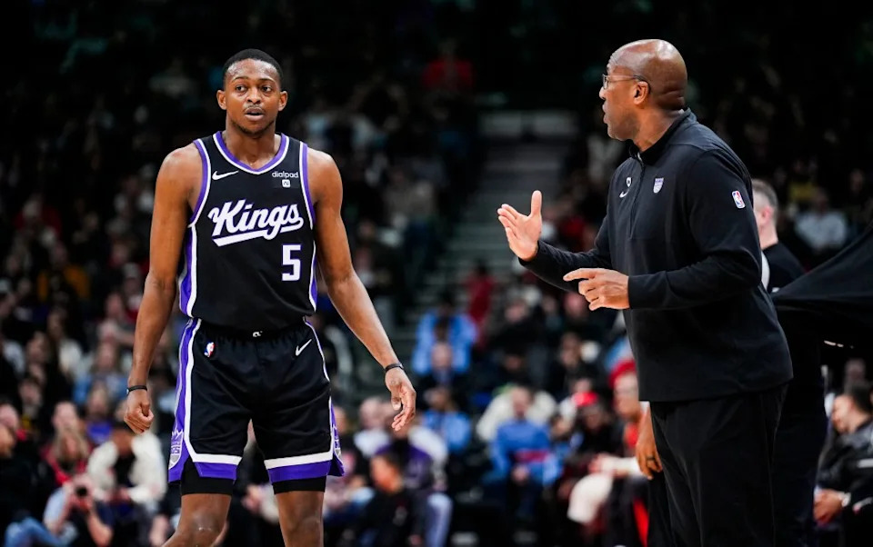 De'Aaron Fox #5 of the Sacramento Kings speaks to head coach Mike Brown.