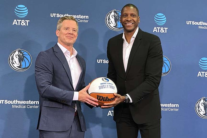 New Dallas Mavericks coach Dusty May, left, poses with president of basketball operations Masai Ujiri, right, during May's introductory NBA news conference in Dallas, Monday, June 29, 2026. (AP Photo/Schuyler Dixon)