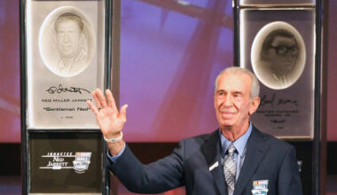 Ned Jarrett waves to the crowd after being inducted into the NASCAR Hall of Fame in Charlotte, ...