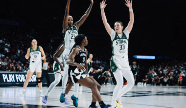 Aces guard Jackie Young (0) is met by Seattle Storm defense in a WNBA basketball game at Michel ...