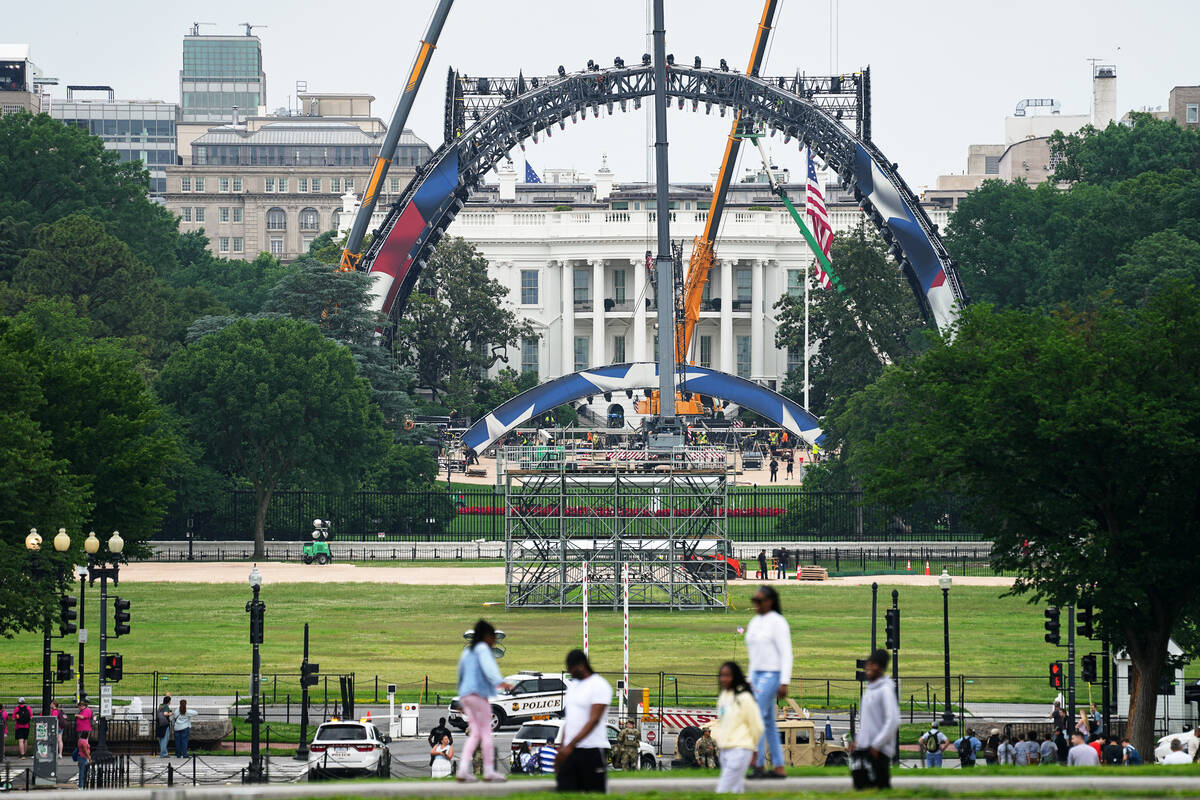 Construction continues at the White House to build a temporary structure for next month's ...