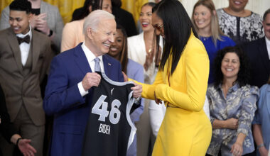 A'ja Wilson, of the WNBA's Las Vegas Aces, right, presents a jersey to President Joe ...