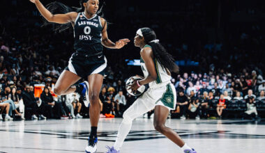 Aces guard Jackie Young (0) plays defense against Seattle Storm guard Flau'jae Johnson (4) ...