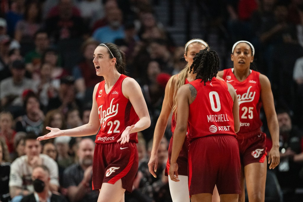 Caitlin Clark of the Indiana Fever reacts after a foul call during a basketball game.