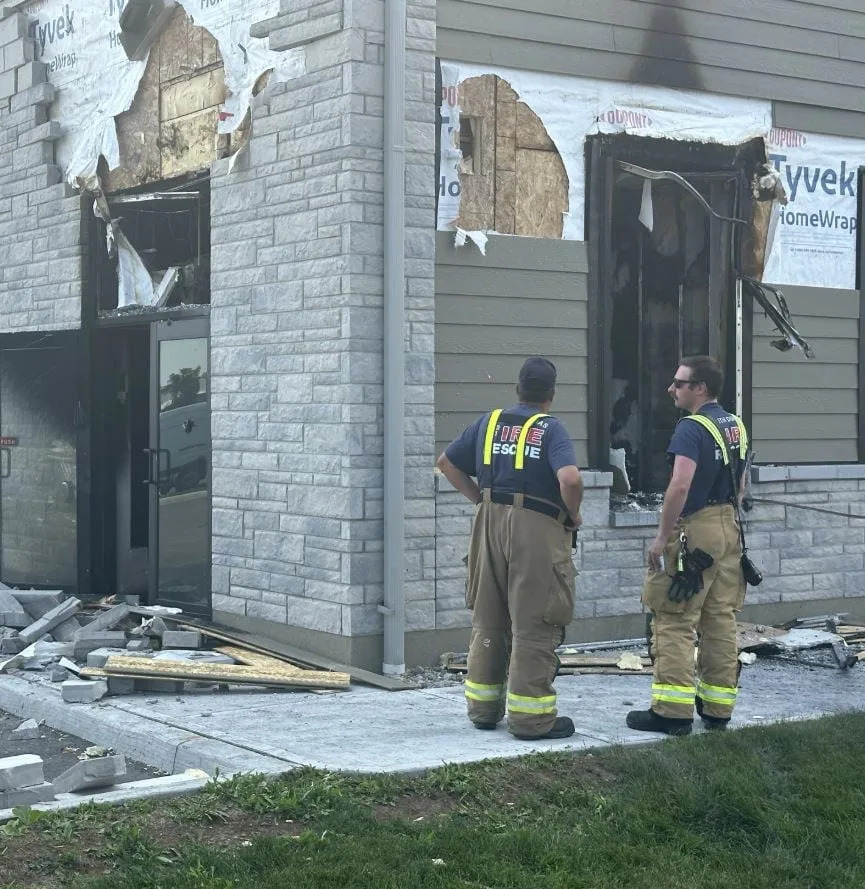 A business in Iroquois, Ont., was damaged by fire Monday. Police believe that scene is connected to the murder-suicide.