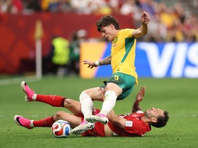 Jordan Bos #5 of Australia is challenged by Hakan Calhanoglu #10 of Turkiye during the FIFA World Cup 2026 Group D match between Australia and Türkiye at BC Place Vancouver on June 13, 2026 in Vancouver, British Columbia. (Photo by Stu Forster/Getty Images)