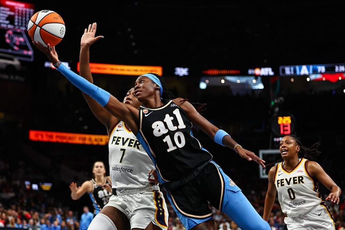 Rhyne Howard (10) of the Atlanta Dream shoots against Aliyah Boston (7) of the Indiana Fever during Atlanta’s 113-96 win over Indiana on June 20 at State Farm Arena. A former Kentucky Wildcats star, Howard is averaging career highs in scoring (19.1 points) and steals (2.7) so far in the 2026 WNBA season.