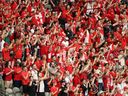 Fans celebrate Canada's 6-0 win in the World Cup Group B match between Canada and Qatar at B.C. Place on June 18.
