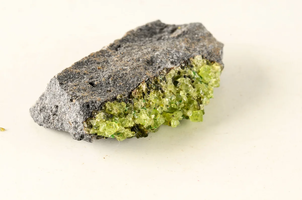 Olivine is an iron-rich mineral commonly found in the upper mantle of Earth. Credit:  Getty/Underworld111