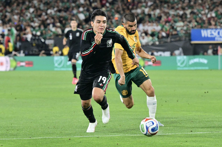 Mexico's midfielder Gilberto Mora vies for the ball with Australia's defender Aziz Behich during a friendly match in Pasadena, Calif., on May 30, 2026.