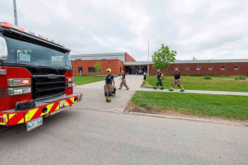 WFPS crews at Sisler High School Friday morning (Mike Deal / Free Press)