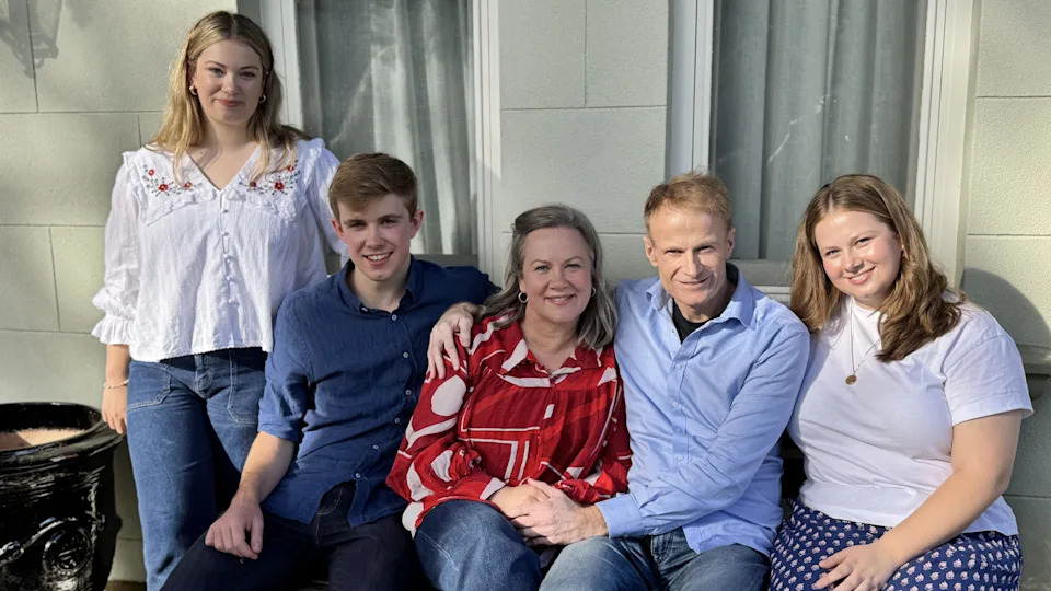 The Scolyer family sit and pose for a photo