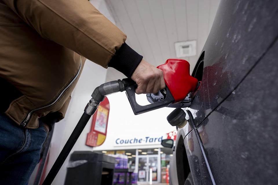 A person fills up their car at a gas station in Montreal on Thursday, March 5, 2026. THE CANADIAN PRESS/Christopher Katsarov - The Canadian Press