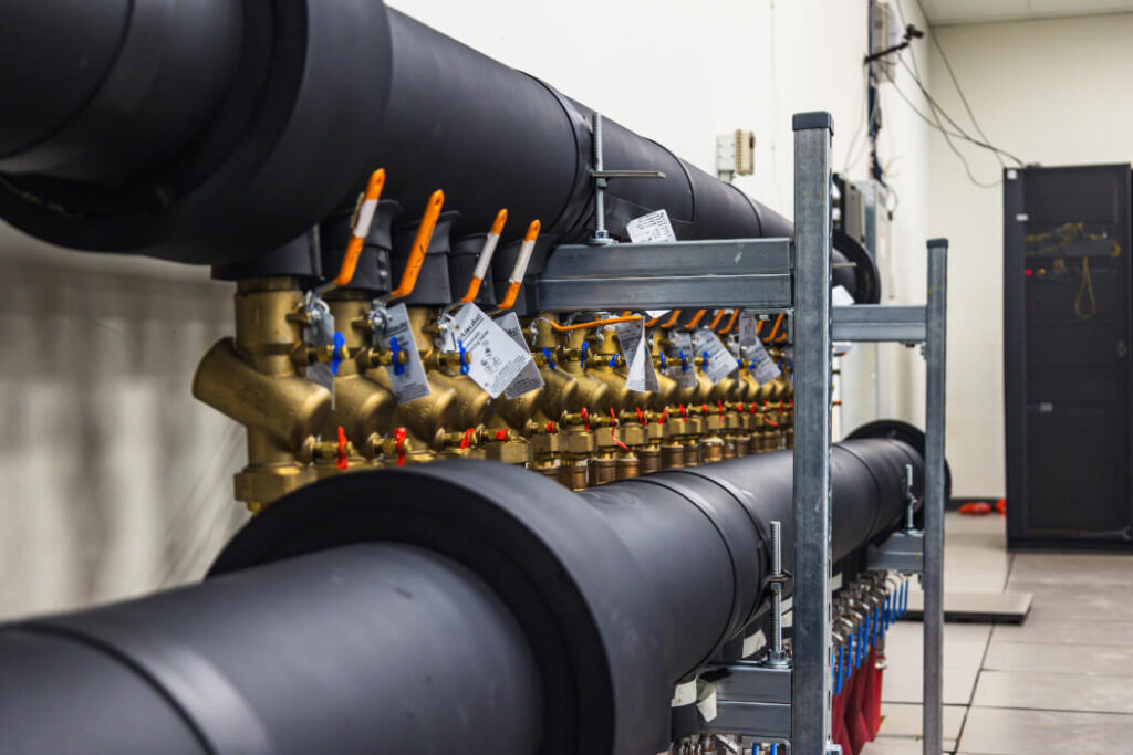 Large, black pipes connected to the Trillium Supercomputer.