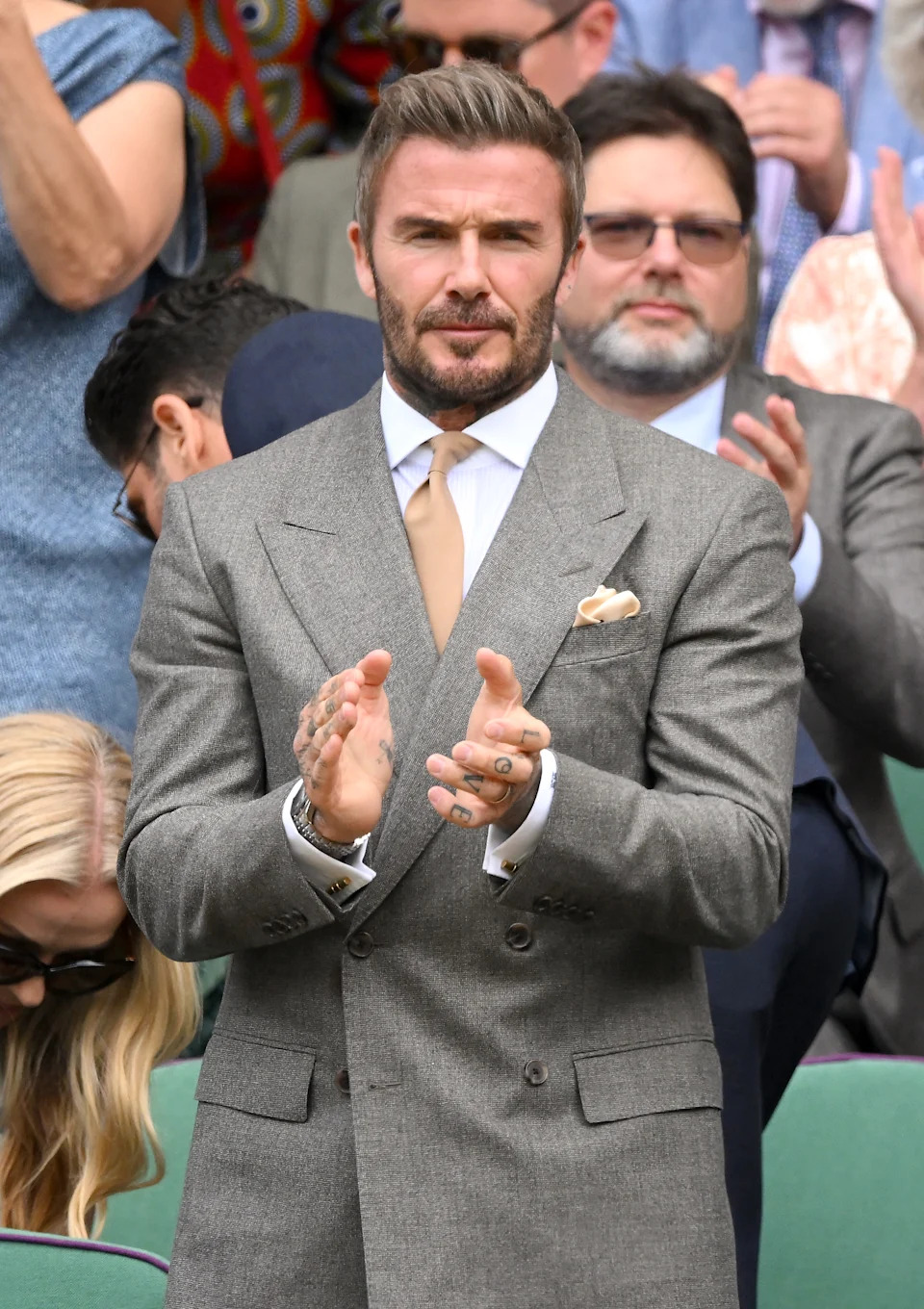 David Beckham in a suit and tie at Wimbledon on Monday.