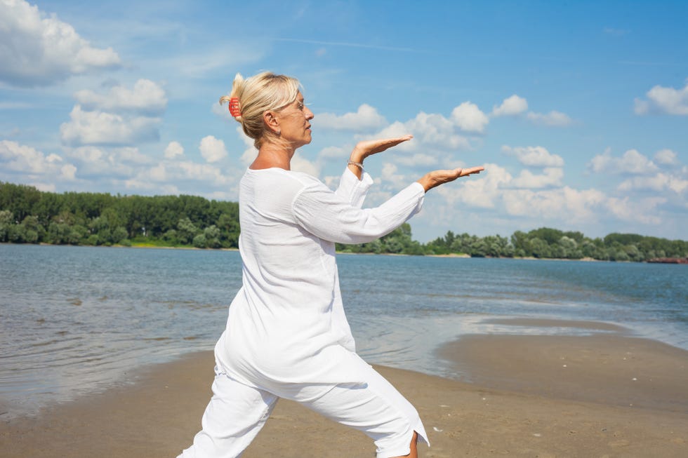 adult woman practising tai chi