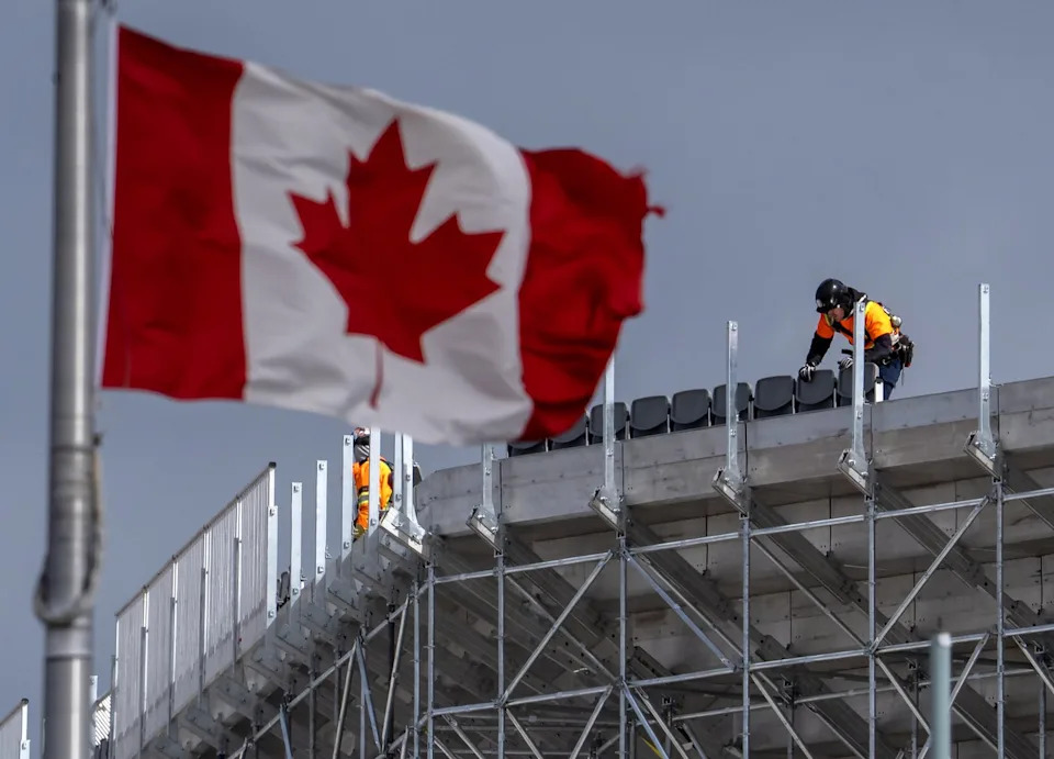 Workers assemble temporary seating high in the air for the FIFA World Cup at BMO Field in Toronto on March 12, 2026. THE CANADIAN PRESS/Frank Gunn