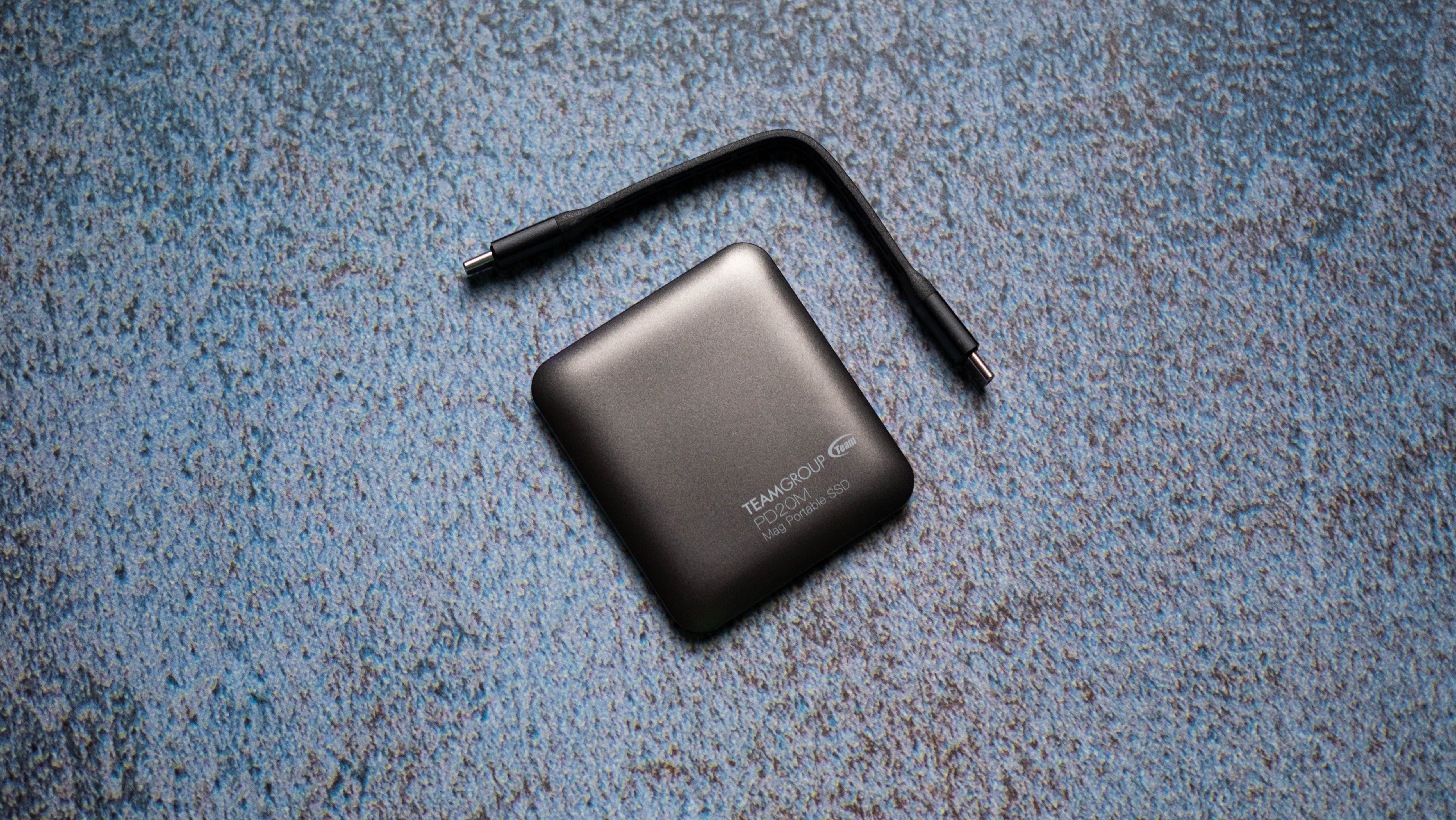 TeamGroup PD20M MagSafe SSD design photos against a craft sheet
