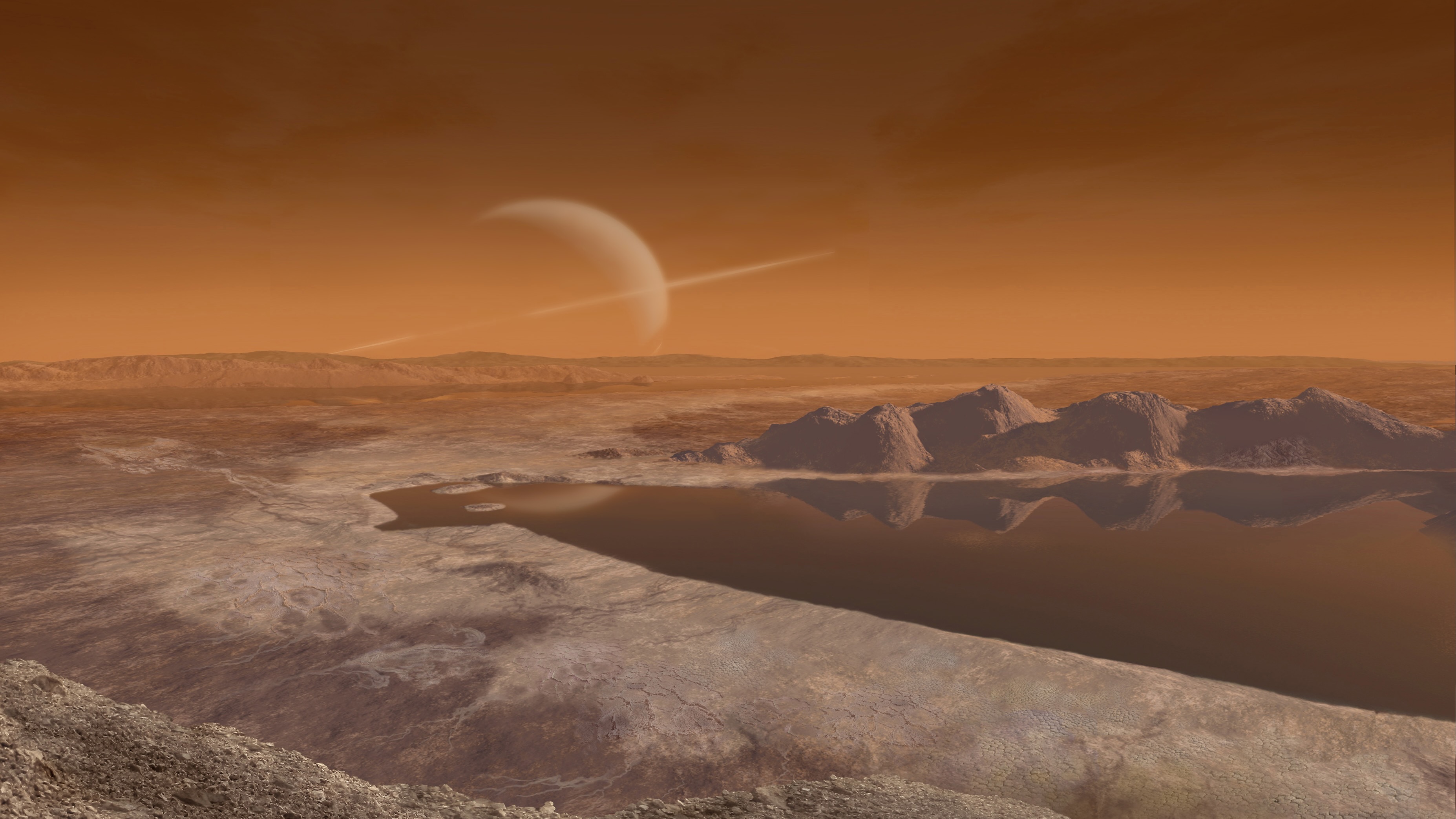 illustration showing the surface of a brown alien landscape with a lake in the foreground and saturn hanging in the sky in the background