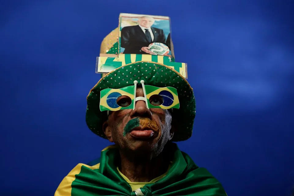 A Brazil fan poses before watching the World Cup match between Brazil and Morocco at Copacabana beach in Rio de Janeiro, Brazil, Saturday, June 13, 2026. (AP Photo/Bruna Prado)