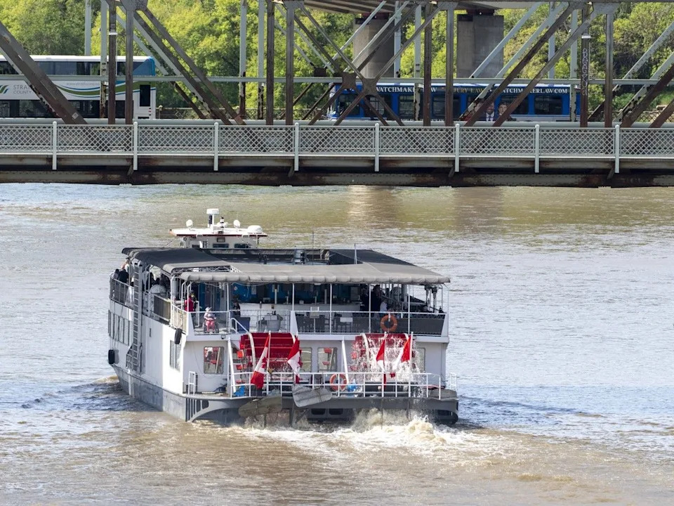 The Edmonton Riverboat goes under the James MacDonald Bridge on the bloated North Saskatchewan River Friday, June 26, 2026, in Edmonton. Greg Southam-Postmedia