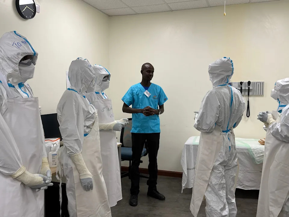 Doctors from various countries in East Africa are training in safe practices at an Ebola treatment centre as part of the tEACH project, which is being carried out jointly by experts from the Institute of Global Health and the Department of Infectious Diseases and Critical Care Medicine at Berlin's Charité Hospital. Eva Krafczyk/dpa
