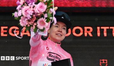 Dutch rider Anna van der Breggen wearing the pink jersey on the podium