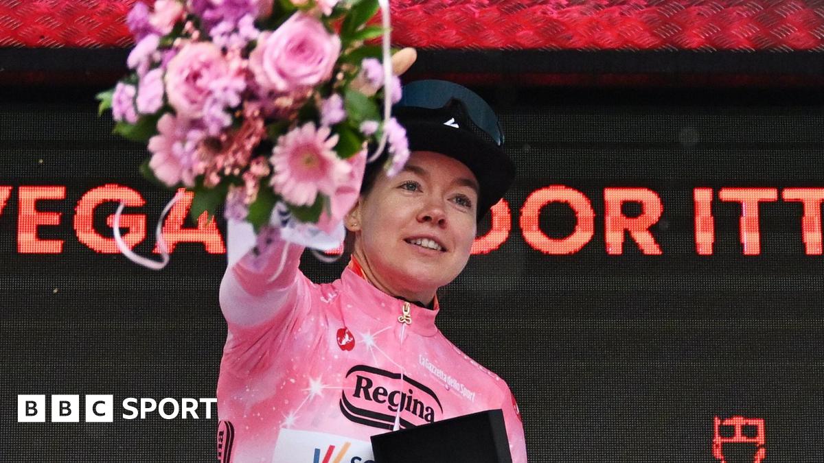 Dutch rider Anna van der Breggen wearing the pink jersey on the podium