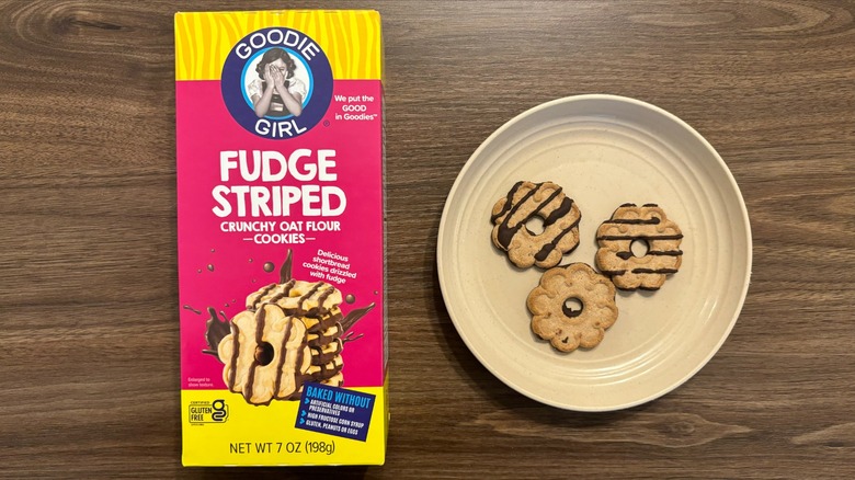 Goodie Girl Gluten Free Baked Fudge Striped Cookies box and gluten-free cookies on brown plate