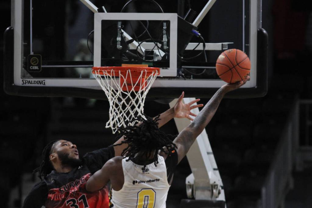 Calgary Surge centre Javonté Brown tries to block a shot from Edmonton Stingers forward Tre King during Canadian Elite Basketball League action at the Marchant Crane Centrium in Red Deer on Sunday, May 31. (Photo by Sean McIntosh/Advocate staff)