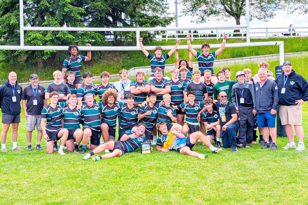 The Lord Tweedsmuir senior boys rugby team celebrate with a photo under the posts after winning the Tier II provincial championship May 30 in Abbotsford. The squad dominated their competition as they rattled off three-straight wins to capture the provincial title. (Submitted to Cloverdale Reporter/Walter van Halst)