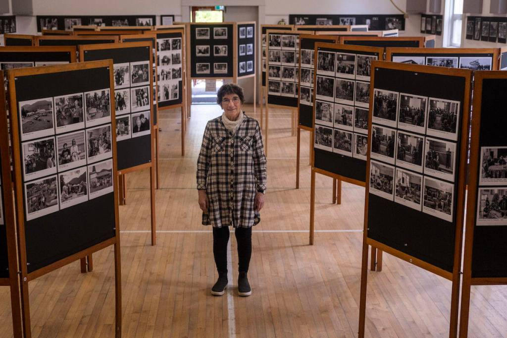 Harrop-Procter photographer Ursula Heller stands among the 498 photographs that made up her exhibit entitled Our Side. (Bill Metcalfe/Nelson Star)