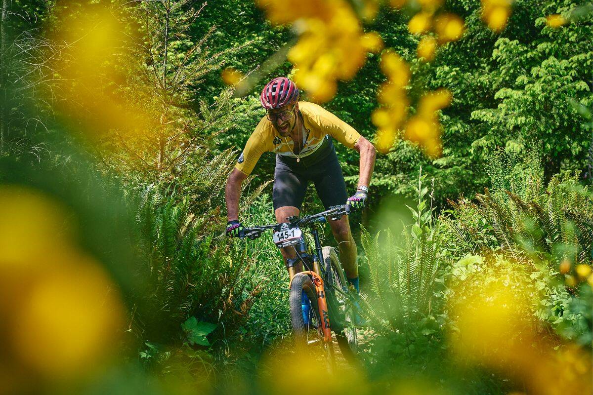 West Shore RCMP Sgt. Dave Vunic navigates a technical section during the 2026 BC Bike Race. (Photo courtesy of BC Bike Race)