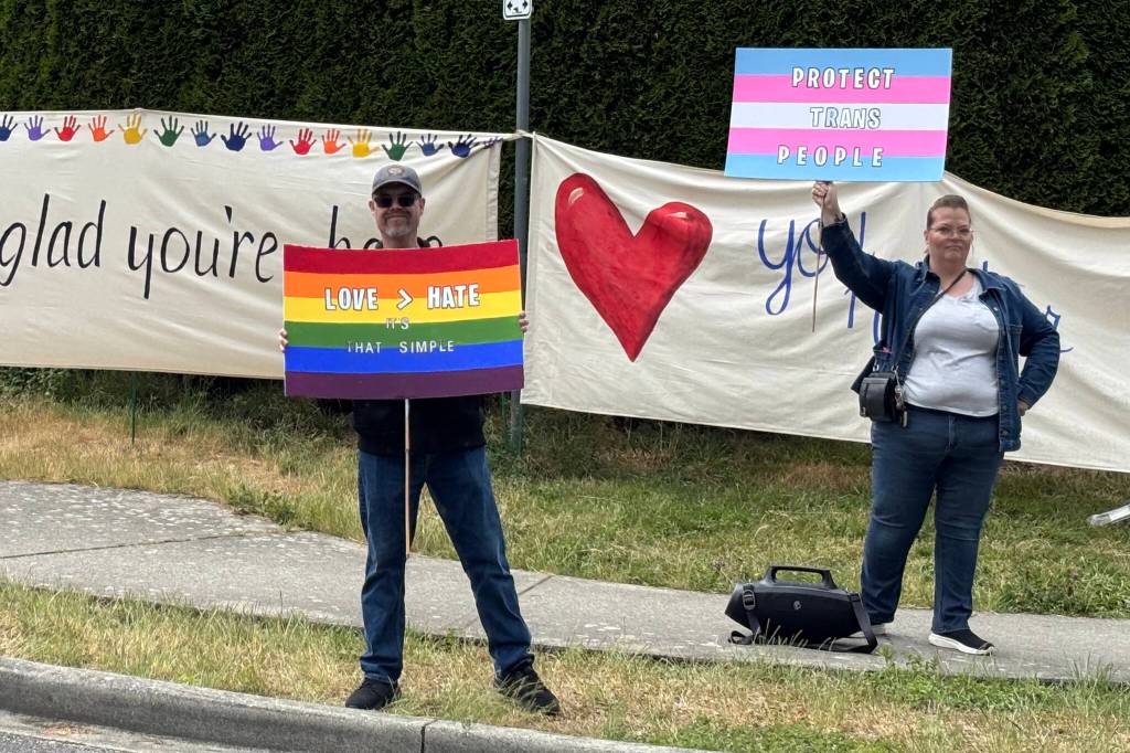 Parents and supporters organized a rally outside L.A. Matheson Secondary School on Tuesday afternoon (June 9) to show support for the 2SLGBTQ+ community after vandals defaced a rainbow crosswalk. (Grace McLeod/Peace Arch News)