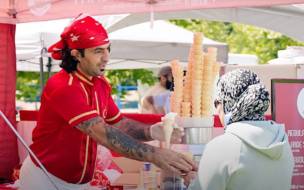 A vendor serves ice cream during the 2023 B.C. Halal Food Fest at Holland Park in Surrey. This year&rsquo;s event is moving to Cloverdale and being expanded to three days. (screenshot/youtube.com)