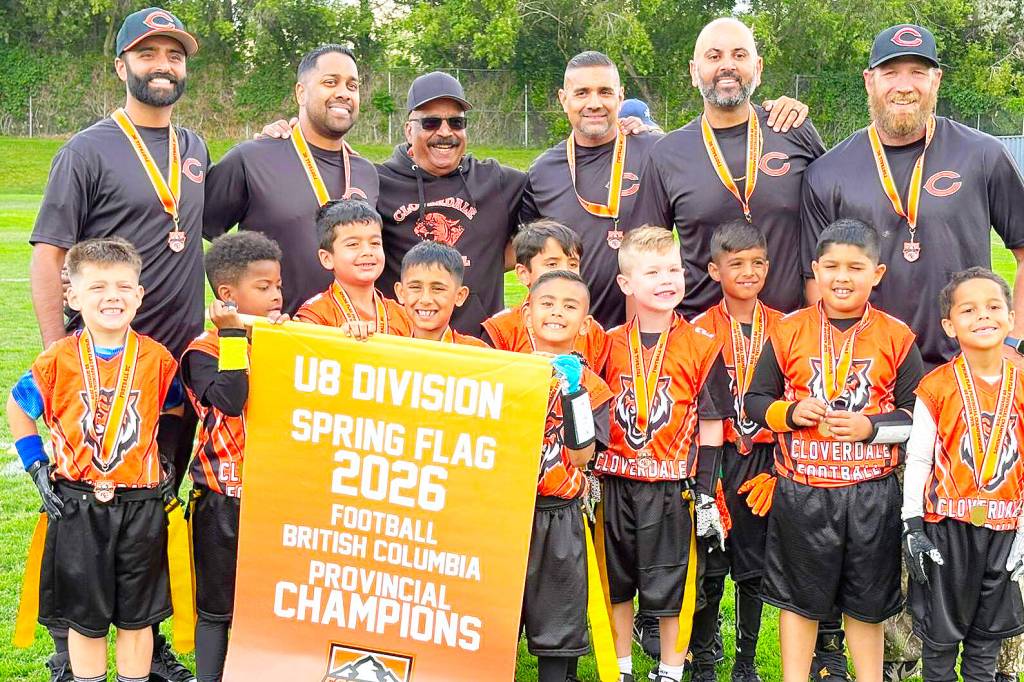 The U8 spring flag team from the Cloverdale Community Football Association pauses for a pic with their provincial championship banner June 7 in Kamloops. The CCFA is now accepting player for their fall flag football program. (Photo submitted to Cloverdale Reporter/Yeera Sami)