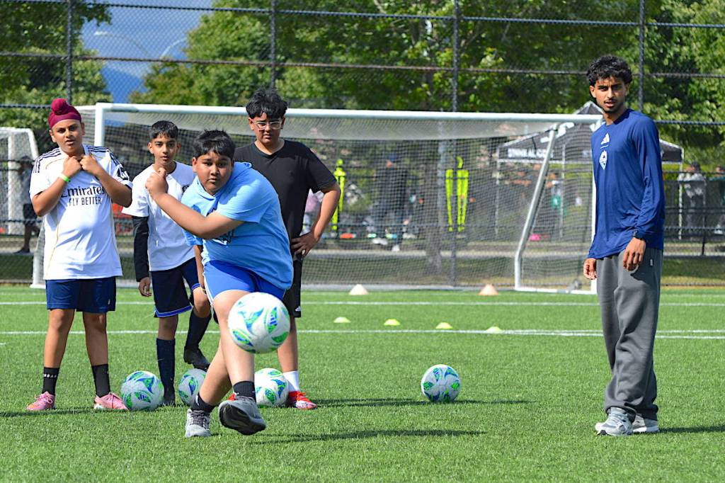 Action at soccer camp led by Jeevan Badwal (pictured at right), David Ousted and Chris Higgins at Newton Athletic Park on Wednesday, June 10, 2026. (Tom Zillich/Surrey Now-Leader)