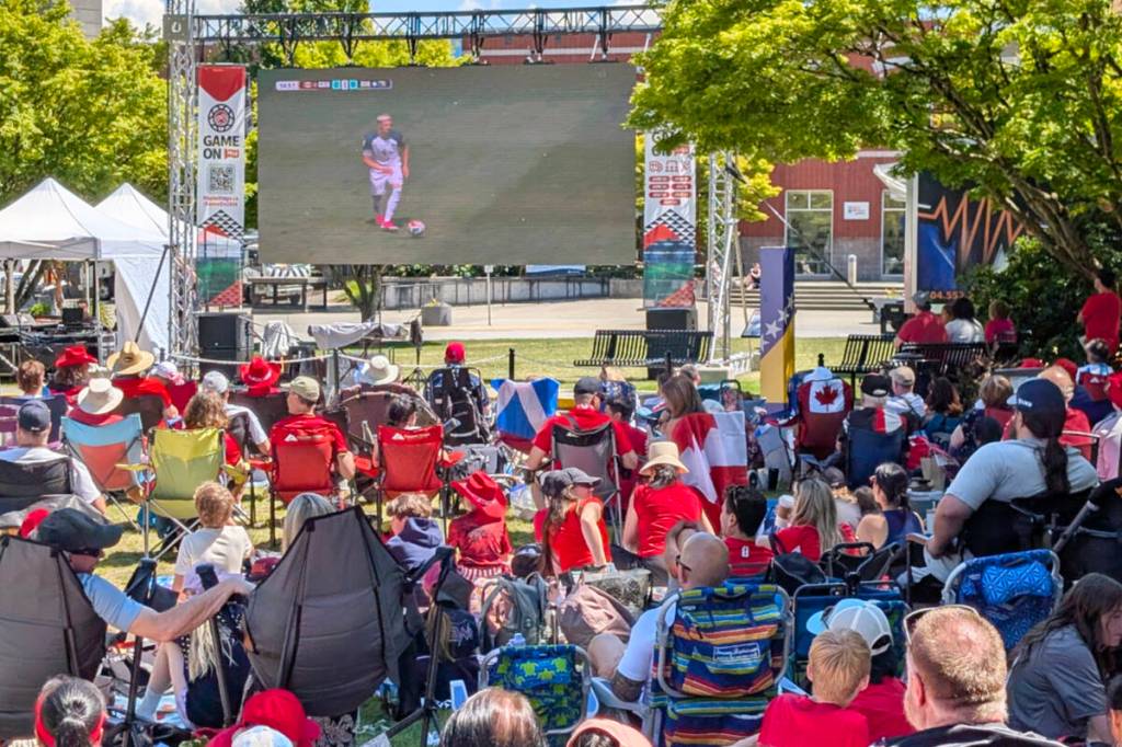 Soccer fans brought lawn chairs and blankets and found a spot in front of the 20-foot screen. (Neil Corbett/The News)
