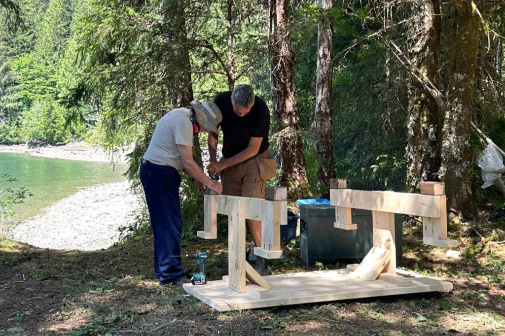 Volunteers build a new picnic table at Santiago Creek campsite on Tahsis Inlet on Vancouver Island&rsquo;s west coast. (BC Marine Trails)