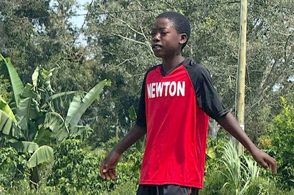 Newton Canadian Baseball Association jersey worn by youth soccer player in Kyotera District, Uganda, following a donation to Surrey-based Yavin Society, or Youths As Volunteers Integrated Network. (Contributed to Surrey Now-Leader)